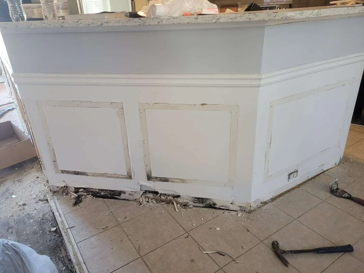 Water damage and mold on kitchen during Sewage Cleanup & Sanitation in Glen Cove